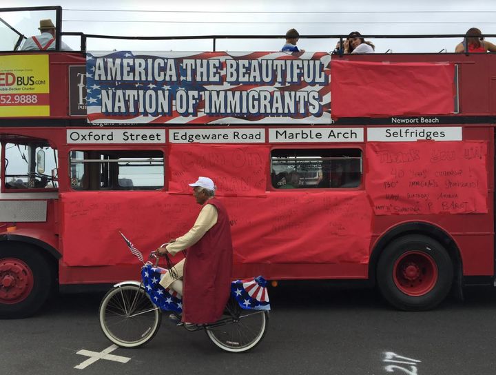 The author's dad, Surendra P. Barot, on a decorated bike riding next to the immigrant float.