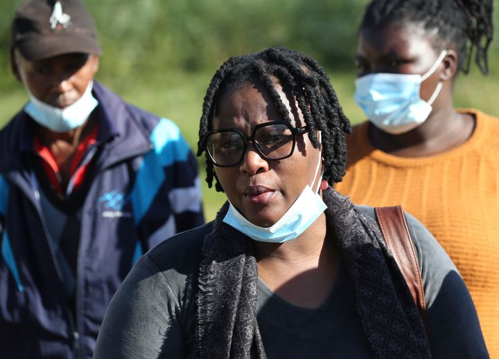 Yandiswa Ngqoza, with family members after identifying her daughters at the Woodbrook Mortuary in East London, South Africa Monday, June 27, 2022.