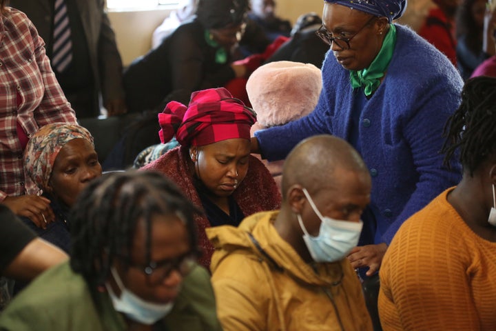 Mourners attend a service at the Assembly of God Church in Scenery Park, East London, South Africa Monday, June 27, 2022.