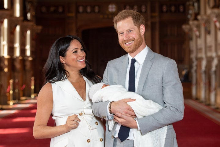 The Duke and Duchess of Sussex pose with their newborn son, Archie Harrison Mountbatten-Windsor, during a photo call at Windsor Castle on May 8, 2019 in Windsor, England.