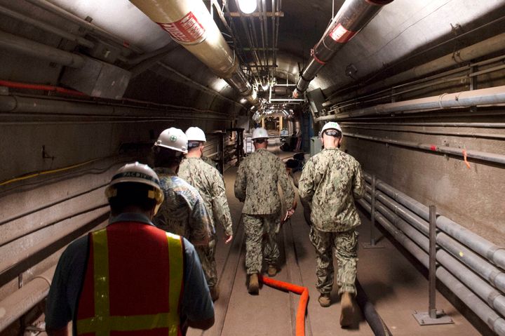 Rear Adm. John Korka, Commander, Naval Facilities Engineering Systems Command (NAVFAC), and Chief of Civil Engineers, leads Navy and civilian water quality recovery experts through the tunnels of the Red Hill Bulk Fuel Storage Facility, near Pearl Harbor, Hawaii.