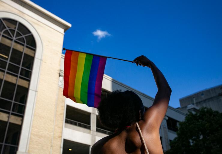 A person waves a rainbow flag during celebrations for Pride Month on June 25 in Raleigh, North Carolina. A written opinion by one justice in the Supreme Court's decision to bury abortion rights has ignited fears that other progressive gains, including same-sex marriage and contraception, could also be overturned.