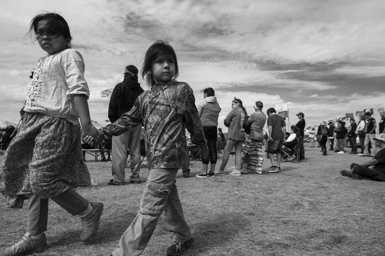 Two children walk together at a protest camp near Cannon Ball, North Dakota, where protesters gathered to voice their opposition to the Dakota Access Pipeline, September 3, 2016.