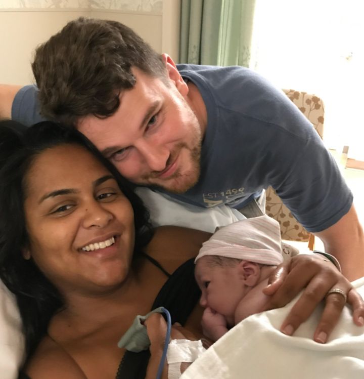 The author with her spouse and son right after his birth.