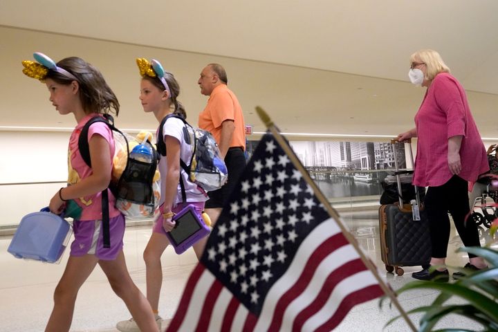 Airline Passengers Arrive At Chicago'S Midway International Airport On Friday, July 1, 2022, The First Day Of The July 4 Holiday Weekend.  The Fourth Of July Holiday Weekend Is Fast Approaching, With Airport Congestion Crushing The Numbers Seen In 2019 Before The Pandemic.