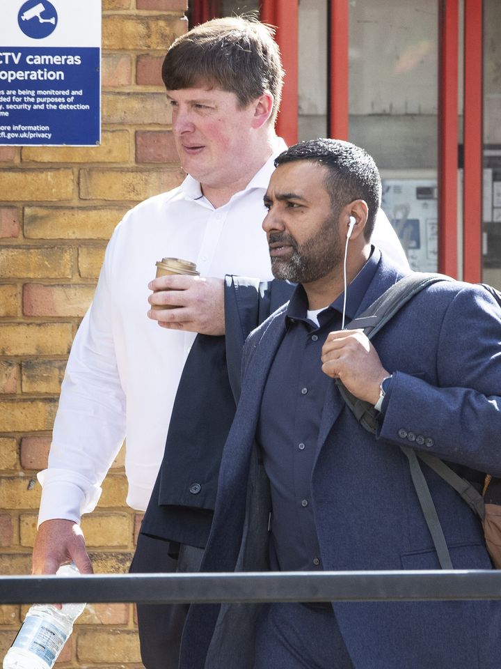 Pc Sukhdev Jeer (right) and Pc Paul Hefford arriving for a misconduct hearing at Empress State Building, London.