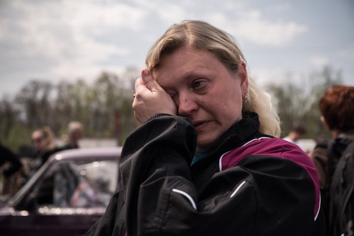 A refugee from the Russian-occupied city of Mariupol, Ukraine, Nadiajda Vorotylina, cries on arriving at a Ukrainian processing center in Zaporizhzhia on May 2.