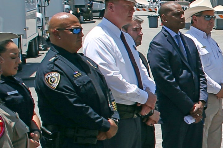 Uvalde School Police Chief Pete Arredondo, second from left, stands during a news conference outside of the Robb Elementary school in Uvalde, Texas, on May 26, 2022. 