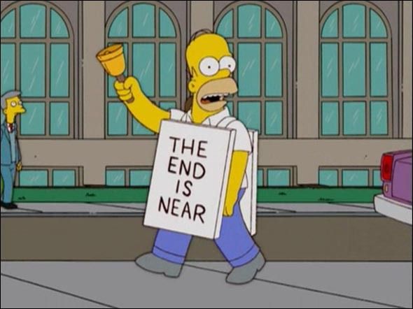 Homer Simpson con el cartel 'El fin está cerca'.