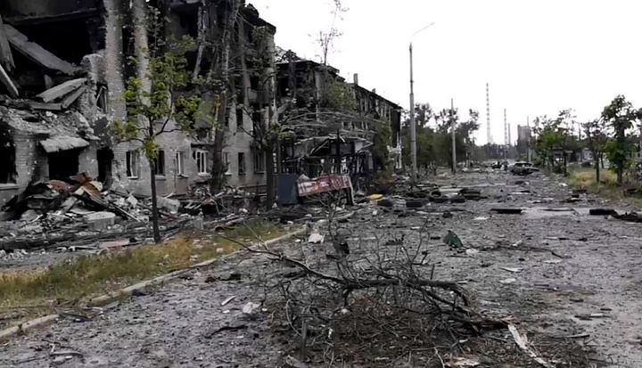 In this photo provided by the Luhansk region military administration, damaged residential buildings are seen in Lysychansk, Luhansk region, Ukraine, early Sunday, July 3, 2022. (Luhansk region military administration via AP)
