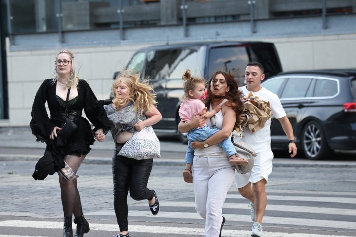 People leave Field's shopping centre, after Danish police said they received reports of shooting, in Copenhagen, Denmark, July 3, 2022. Ritzau Scanpix/Olafur Steinar Gestsson via REUTERS ATTENTION EDITORS - THIS IMAGE WAS PROVIDED BY A THIRD PARTY. DENMARK OUT. NO COMMERCIAL OR EDITORIAL SALES IN DENMARK.