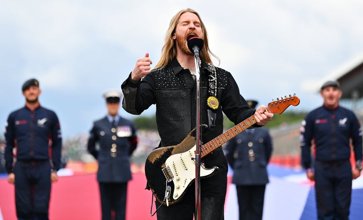 Musician Sam Ryder performs the British national anthem on the grid before the F1 Grand Prix of Great Britain on July 3 in Northampton, England.