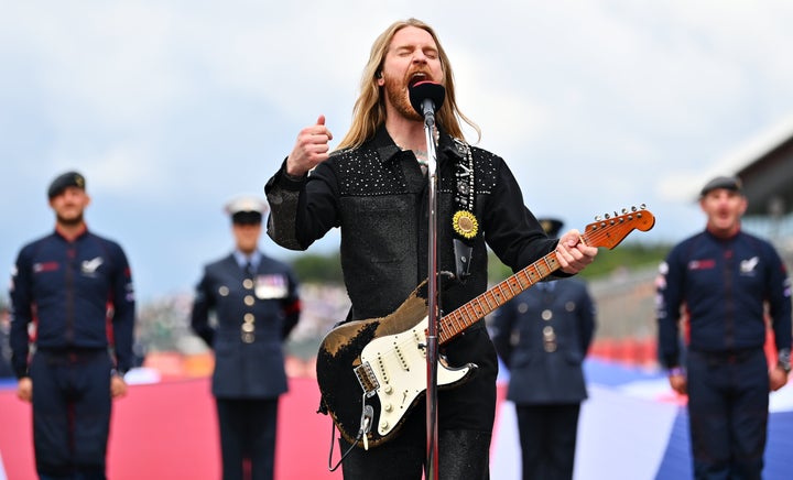 Musician Sam Ryder performs the British national anthem on the grid before the F1 Grand Prix of Great Britain on July 3 in Northampton, England. 