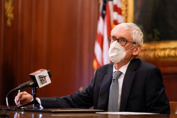 Wisconsin Gov. Tony Evers, a member of Wisconsin's Electoral College, casts his vote for the presidential election at the state Capitol on December 14, 2020 in Madison, Wisconsin.