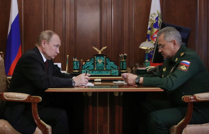 Russian President Vladimir Putin meets with Defence Minister Sergei Shoigu at the Kremlin in Moscow on July 4, 2022. 
