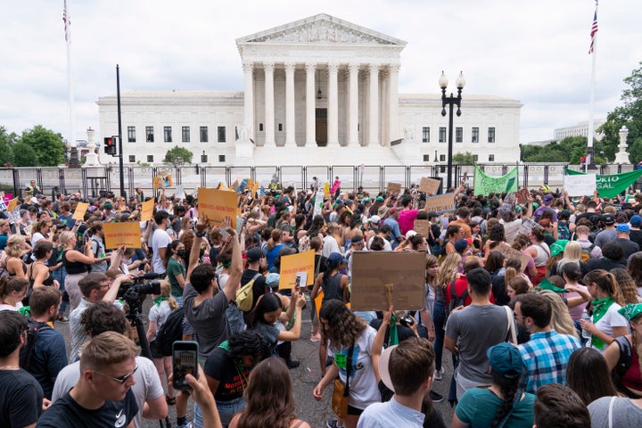 Protesters gather outside the Supreme Court in Washington, Friday, June 24, 2022. After the U.S. Supreme Court revoked the federal right to an abortion that's been in place for half a century, companies like Amazon, Disney, Apple and JP Morgan pledged to cover travel costs for employees who live in states where the procedure is now illegal so they can terminate pregnancies. (AP Photo/Jacquelyn Martin, File)