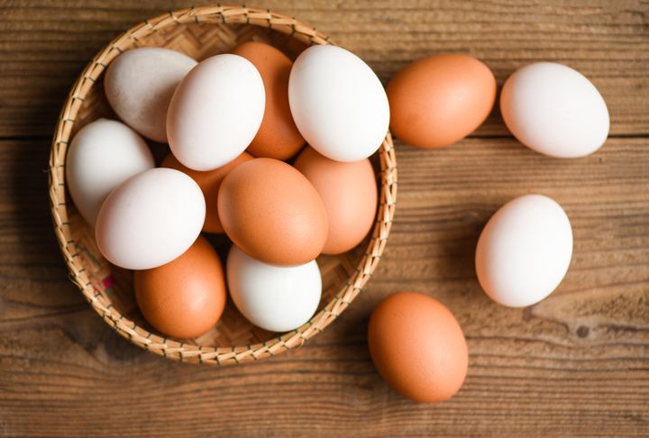Chicken eggs and duck eggs collect from farm products natural in a basket healthy eating concept, Fresh egg