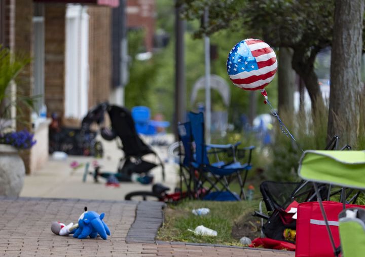 Chairs, bicycles, strollers and balloons were left behind at the scene of a mass shooting on the Fourth of July parade route along Central Avenue in Highland Park, Illinois.