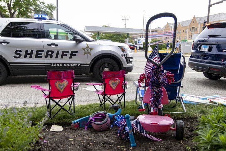Chairs and scooters left behind at the scene of a mass shooting on the Fourth of July parade route Monday, July 4, 2022, in Highland Park. (Brian Cassella/Chicago Tribune/Tribune News Service via Getty Images)