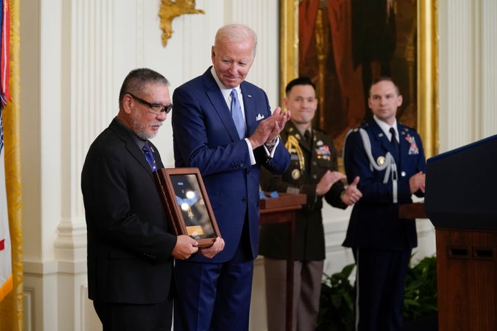 President Biden presents the Medal of Honor to Staff Sgt. Edward Kaneshiro for his actions on Dec. 1, 1966. Kaneshiro's son John accepted the posthumous recognition during a ceremony in the East Room of the White House on Tuesday.