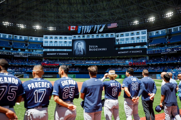 Tampa Bay Rays players and staff stand for a moment of silence on the death of Julia Budzinski, ahead of a game against the Tampa Bay Rays at Rogers Centre on July 3.