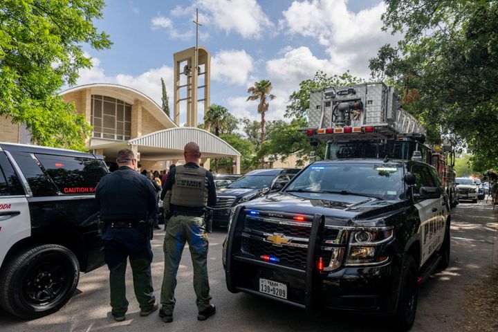 UVALDE, TEXAS - JUNE 01: Law enforcement officers obstruct the view from members of the press during the joint funeral service for teacher Irma Garcia and her husband Joe Garcia on June 01, 2022 in Uvalde, Texas. Irma Garcia was killed in the mass shooting at Robb Elementary School and her husband died a few days later. Wakes and funerals for the 21 victims will be scheduled throughout the week. (Photo by Brandon Bell/Getty Images)