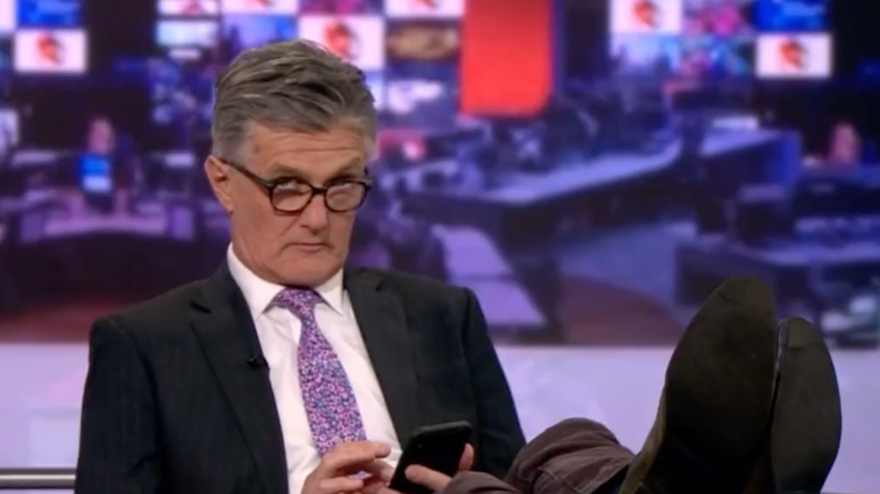 BBC News Presenter Caught Scrolling On Phone With Feet Up During Government Meltdown - Vimarsana News