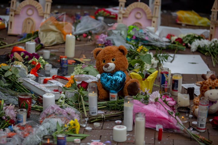 Memorials for those killed near the scene of the parade in Highland Park, Illinois. 