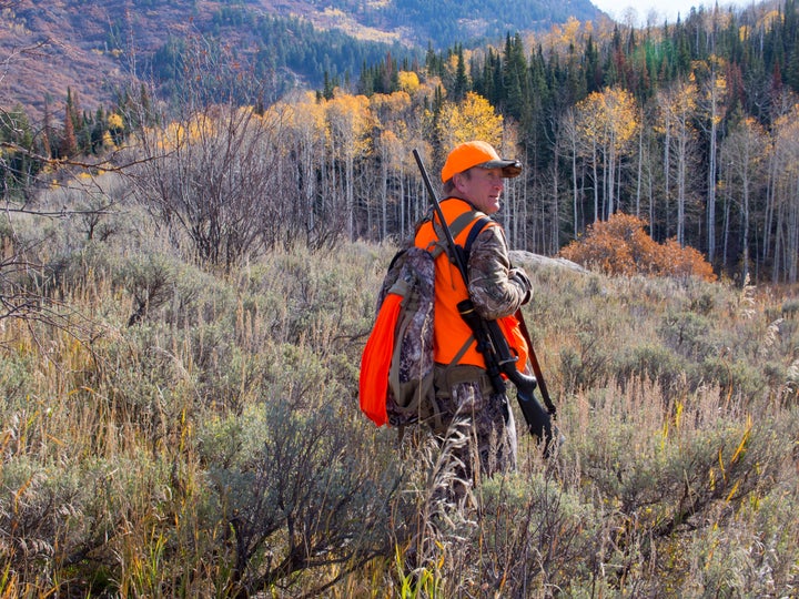 An elk hunter walks through a meadow in northwest Colorado.