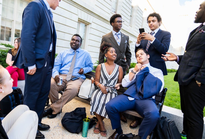 Congressional interns wait to attend a June 9 hearing of the House select committee investigating the Jan. 6, 2021, insurrection. A survey of incoming interns found almost half attend private colleges and almost a quarter come from families with annual incomes of $200,000 or more.
