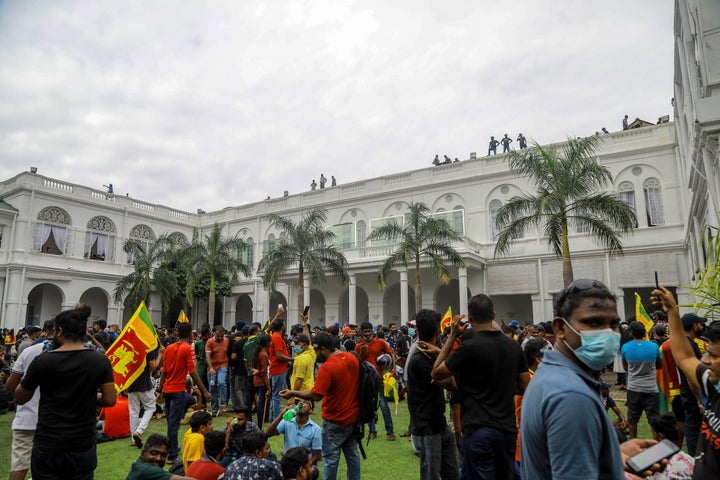 Protesters gather inside the premises of Sri Lankan presidents official residence in Colombo, Sri Lanka, Saturday, July 9, 2022.