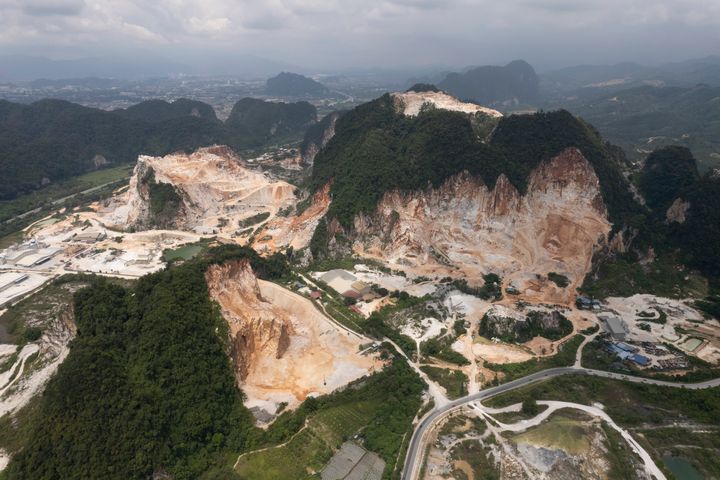 Deforested mountains from massive limestone quarries are seen in Ipoh, Perak state Malaysia, Nov. 5, 2021.