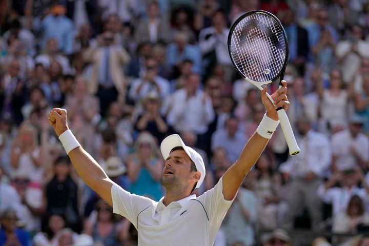 Serbia's Novak Djokovic celebrates after beating Australia's Nick Kyrgios to win the final of the men's singles on day fourteen of the Wimbledon tennis championships in London, Sunday, July 10, 2022. (AP Photo/Alastair Grant)