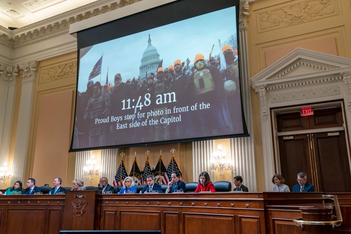 A video is displayed by the committee that claims to shows Proud Boys in front of the Capitol on Jan. 6, 2021, as the House select committee investigating the Jan. 6 attack on the U.S. Capitol a hearing at the Capitol in Washington, June 9, 2022. (AP Photo/J. Scott Applewhite, File)