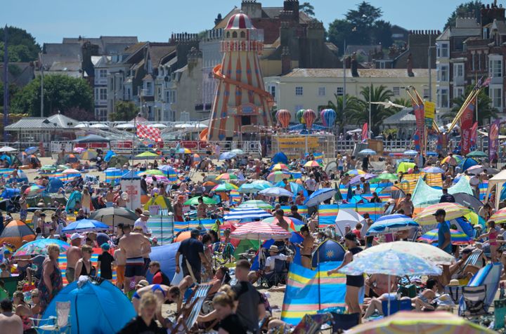  Beach goers enjoy the hot weather on July 10, 2022 in Weymouth, England