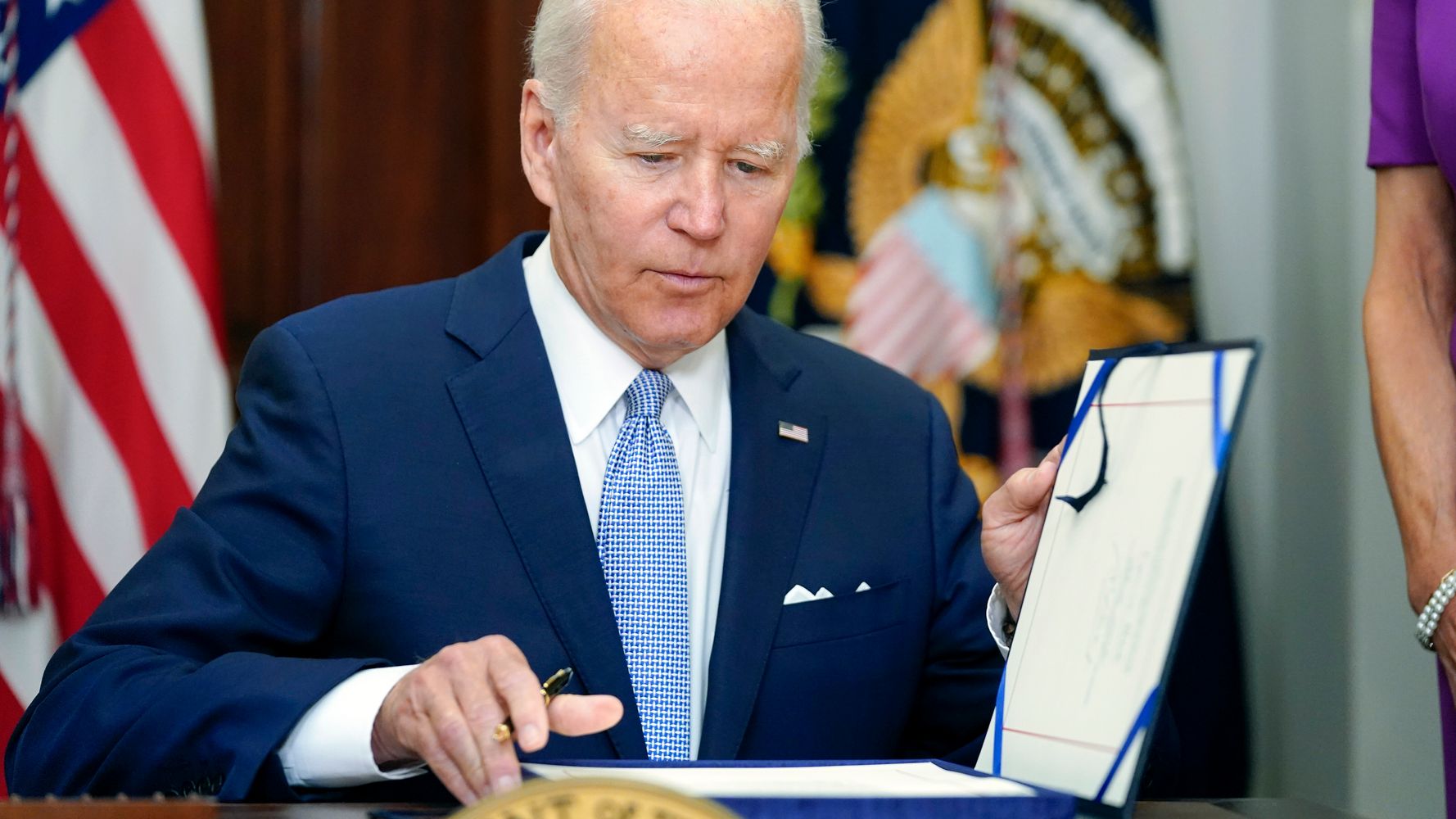 Biden celebration of the new gun law overshadowed by recent footage