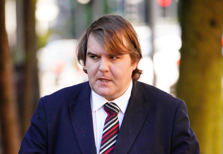 <strong>Bridgend MP Jamie Wallis arrives at Cardiff Magistrates Court.</strong>