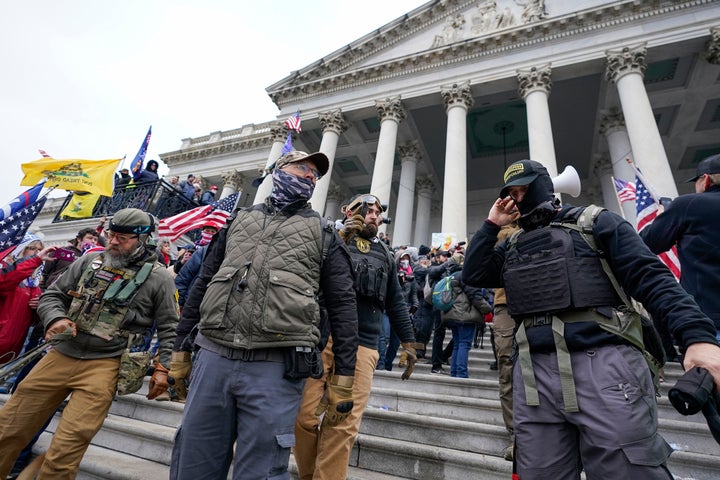 Members of the Oath Keepers gather on the East Front of the U.S. Capitol on Jan. 6, 2021. A hearing of the House select committee investigating the insurrection is expected to examine ties between people in former President Donald Trump's orbit and extremist groups who played a role in the Capitol riot.