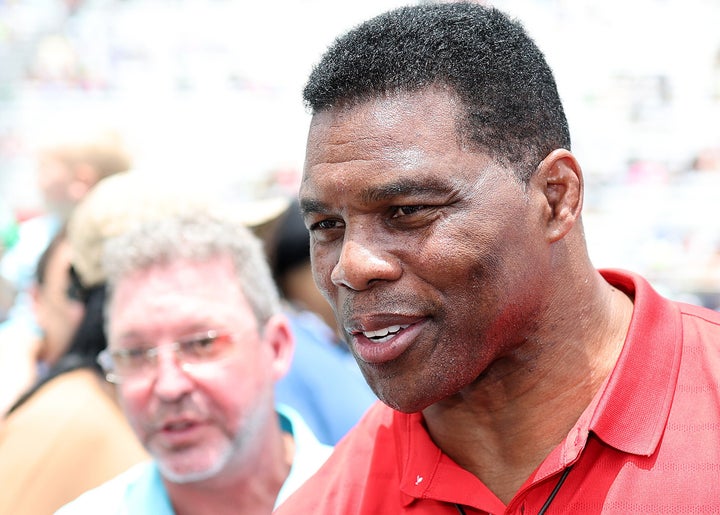 Herschel Walker, Republican candidate for U.S. Senate in Georgia, walks off-stage during pre-race ceremonies at a NASCAR event in Hampton, Georgia, on Sunday.