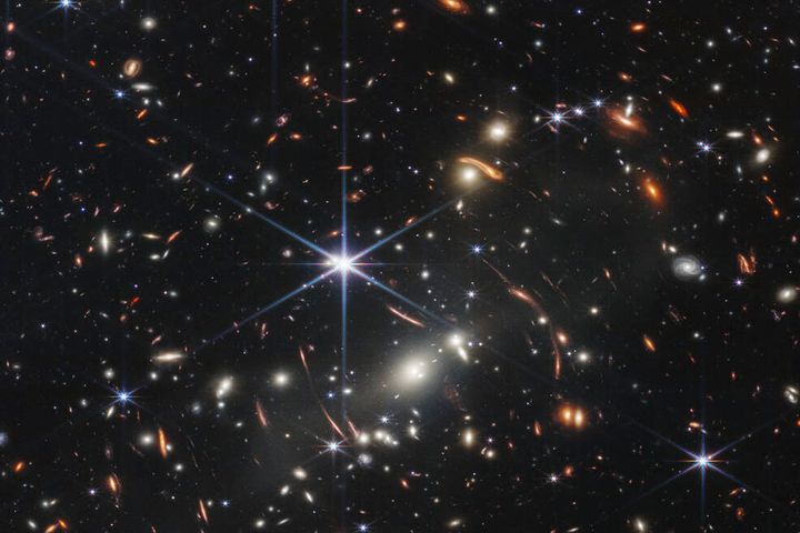 This image provided Monday by NASA shows galaxy cluster SMACS 0723, captured by the James Webb Space Telescope. The telescope is designed to peer back so far that scientists can get a glimpse of the dawn of the universe and zoom in on closer cosmic objects with sharper focus.
