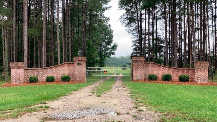 The gates near Alex Murdaugh's home in Islandton, S.C., are seen following last year's shooting deaths of his wife and son at the property,
