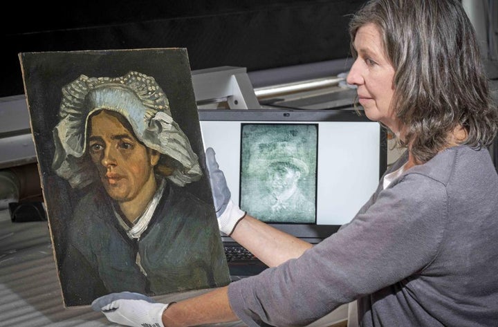 Senior Conservator Lesley Stevenson views "Head of a Peasant Woman" alongside an x ray image of the hidden Van Gogh self portrait.