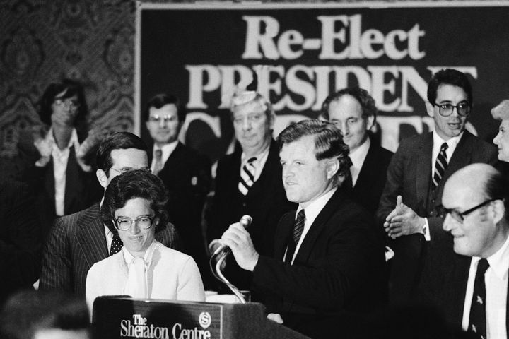 Holtzman, center left, and Sen. Edward Kennedy (D-Mass.), center right, speak at an event in support of President Jimmy Carter's reelection in October 1980.