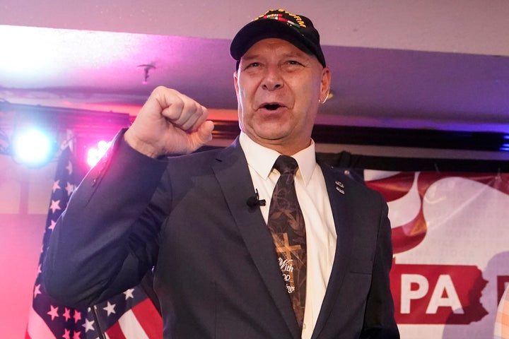 State Sen. Doug Mastriano, the Republican candidate for governor of Pennsylvania, gestures to the crowd during his primary night election party in Chambersburg, Pennsylvania, May 17, 2022.