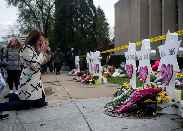 A woman prays at a memorial service for the victims of the Tree of Life massacre in Pittsburgh, Oct. 29, 2018.