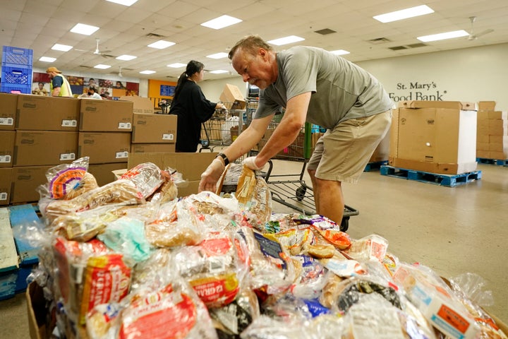 After Reaching New High Of Inflation, There Is A Long Line At The Food Banks With Grocery Prices Rising As Well As Gas Prices, Many Are Looking For Charitable Food For The First Time, And More People Are Arriving On Foot.
