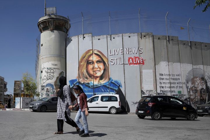 A mural depicting slain Palestinian-American journalist Shireen Abu Akleh adorns a part of Israel's controversial separation barrier, in the West Bank city of Bethlehem, on July 6, 2022. 