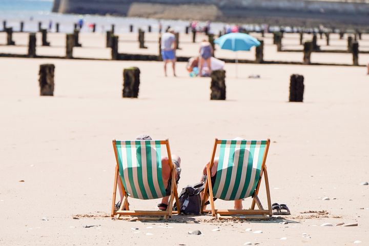 Members of the public enjoy the warm weather on Bridlington Beach on 13 July 2022. (Photo by Giannis Alexopoulos/NurPhoto via Getty Images)