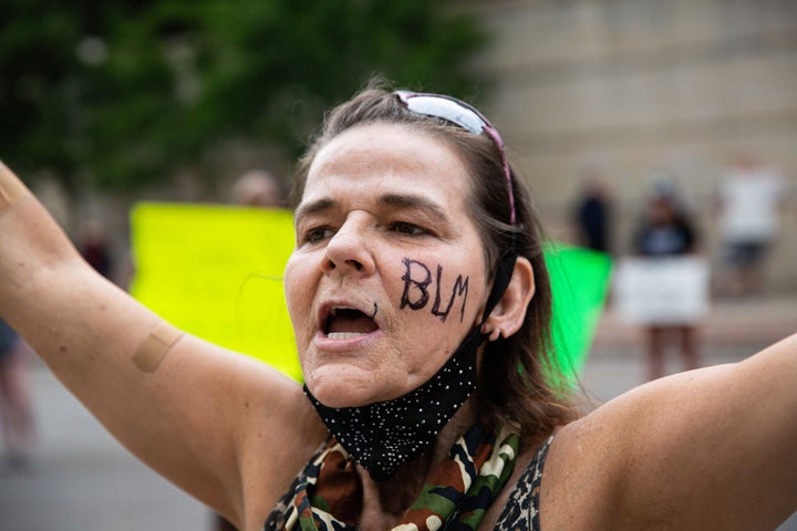 A woman has BLM written on her face during the demonstration. Hundreds of protesters gather to call for justice in the police killing of Jayland Walker.