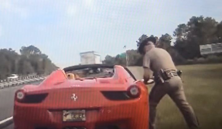 Dashcam footage shows Flagler County Commission Chairman Joe Mullins' red Ferrari during a traffic stop.